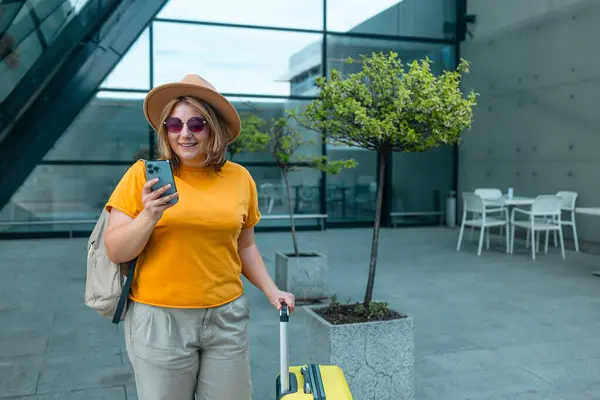 stock image Young Caucasian female passenger in stylish casual clothes sit has training online meeting on laptop computer in airline lounge wait transit international airport. High quality FullHD footage