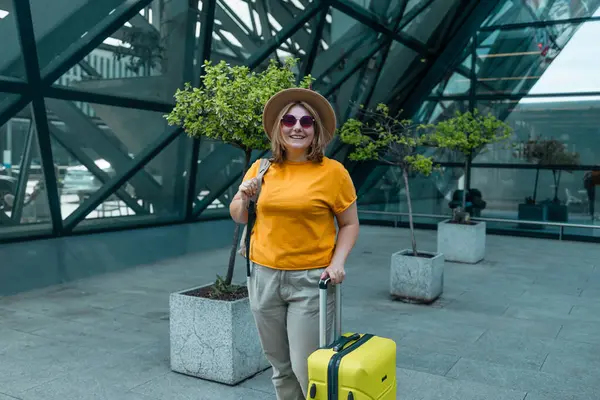 stock image Young Caucasian female passenger in stylish casual clothes sit has training online meeting on laptop computer in airline lounge wait transit international airport. High quality FullHD footage