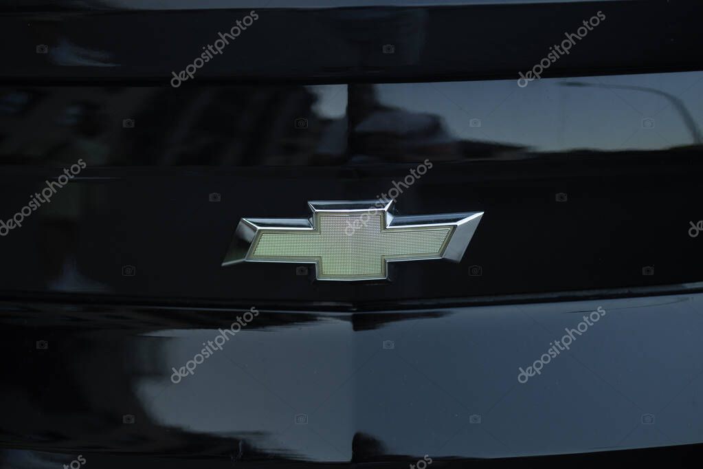 Krakow, Poland - September 2024: A close-up of the front grille of a Chevrolet with the brands iconic logo. The chrome emblem stands out against the black grille. High quality photo