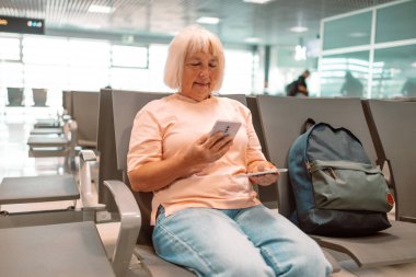 Qr code, check in and man with a phone for a ticket, airplane booking and information at airport. Travel, website and hand of a businessman reading a barcode on a mobile for a work trip or vacation