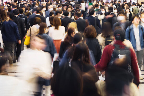 picture of a crowd of people walking in a subway underpass in Tokyo, Japan