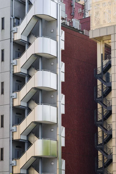 picture of a high-rise residential building with external stairs in Tokyo, Japan