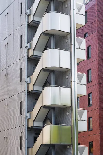 picture of a high-rise residential building with external stairs in Tokyo, Japan