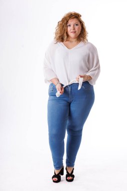 Plus size fashion model, fat woman in denim clothes and white shirt on white background, overweight female body