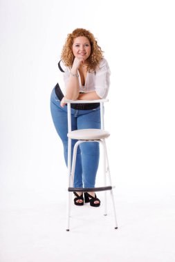 Plus size fashion model, fat woman in denim clothes and white shirt on white background, overweight female body
