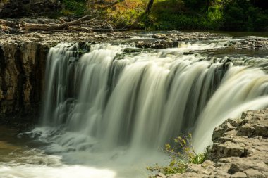 The incredible power in the cascade of water as the river enters the Haruru waterfall in Waitangi