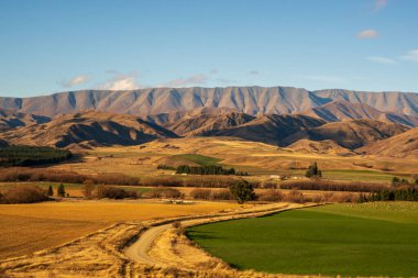 On gravel roads in the remote rural farmland in the Lindis Pass Omarama countryside
