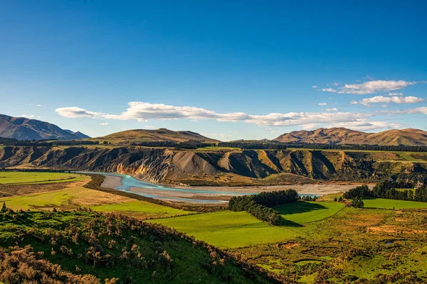 Remote agricultural farmland in the remote area between Mount Hutt and the Rakaia river as it flows through the gorge