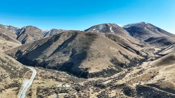 Drone perspective photo of the extreme terrain of the Lindis Pass alpine mountain pass