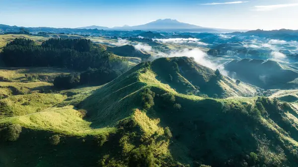Magical mystical morning cloud in the valleys with a backdrop of the central plateau mountains captured by a drone