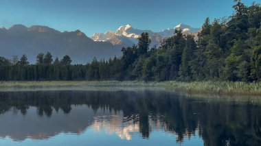 Scenic reflective lake Matheson on the West Coast of NZ clipart