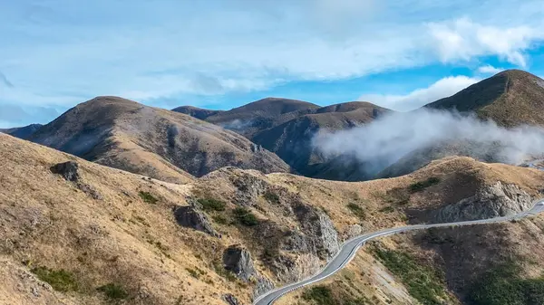 stock image Aerial view of the mountains shrouded in cloud in Torlesse Tussocklands Park