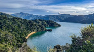 Scenery of the bays and coves in the Marlborough Sounds with some atmospheric cloud clipart