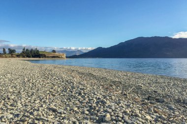 The mountains along both sides of Lake Hawea near Wanaka clipart