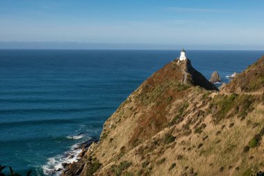 Catlins kıyısındaki Iconic Nugget Point deniz feneri