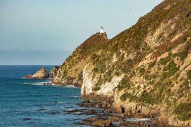 Catlins kıyısındaki Iconic Nugget Point deniz feneri