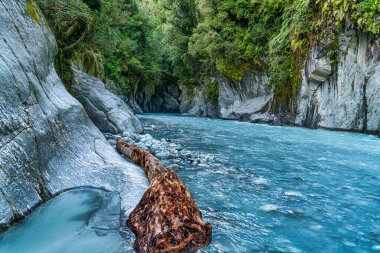 The crystal clear turquoise water in the Callery Gorge at NZ  West Coast near franz Josef