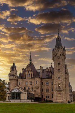 Old historical romantic fairy-tale Moszna castle and palace outdoors, closeup. Poland. Famous tourist landmark, tourism destinatio
