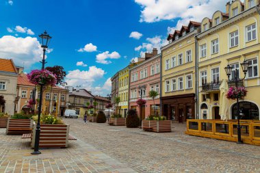 12.07.2022. Jaroslaw city, Poland. Medieval historical central square. Street of old town, town hall, historic houses. Tourism landmar clipart