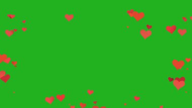 Kalp şekilleri yeşil ekran üzerinde yüzer