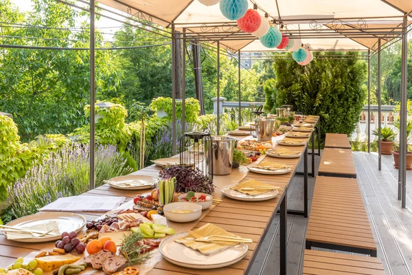 Food served outdoor on a long table