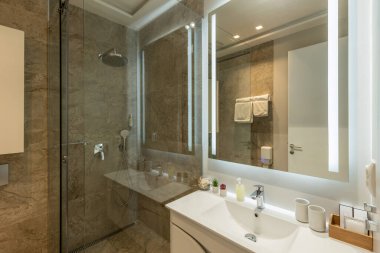 Bathroom interior with glass shower cabin