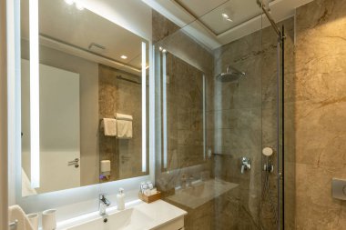 Bathroom interior with glass shower cabin