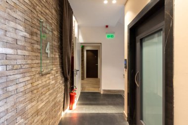 Hotel corridor interior with brick wall decoration
