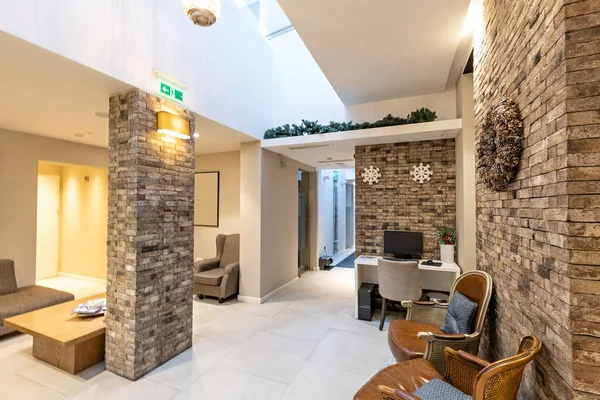 Hotel lobby with decorated stone wall