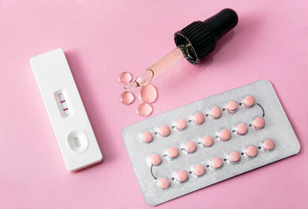 Taking CBD oil together with birth control pills could disrupt hormones and reduce birth control pills effectiveness and result in unwanted pregnancy. CBD oil, birth control pills and pregnancy test.