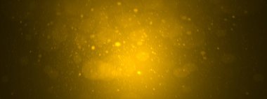 Siyah arka planda turuncu ışıklı ve parıltılı altın