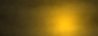 Siyah arka planda turuncu ışıklı ve parıltılı altın