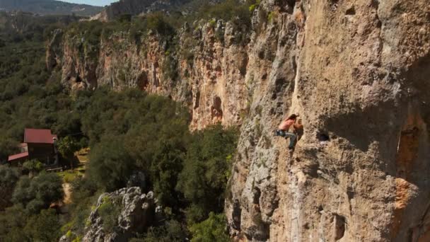 Aerial Slow Motion Filming Drone Strong Muscular Man Rock Climber — Stock Video