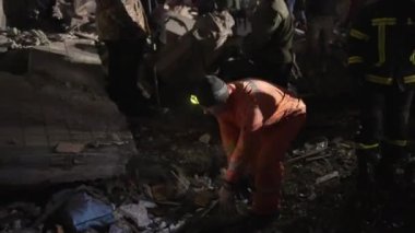 12-storey residential building was destroyed by massive Russian missile attack, work of rescuers and volunteers to clear rubble and search for wounded, Dnipro, Ukraine - 14 Jan 2023. by the evening of