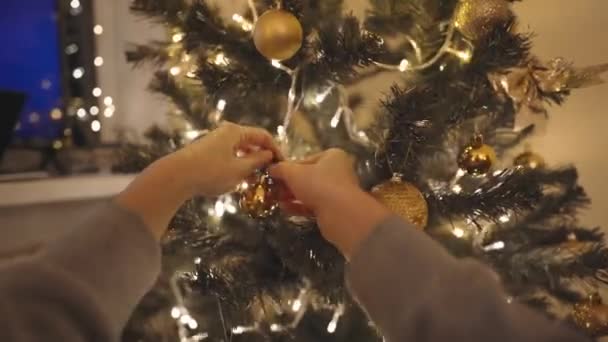 Beautiful Smiling Woman Decorates Christmas Tree Home Bulbs Making Nice — Vídeos de Stock