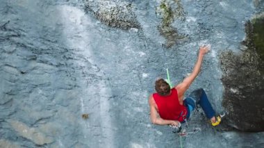 rock climber rest on the ascent route. rock climbing like sports and recreation.