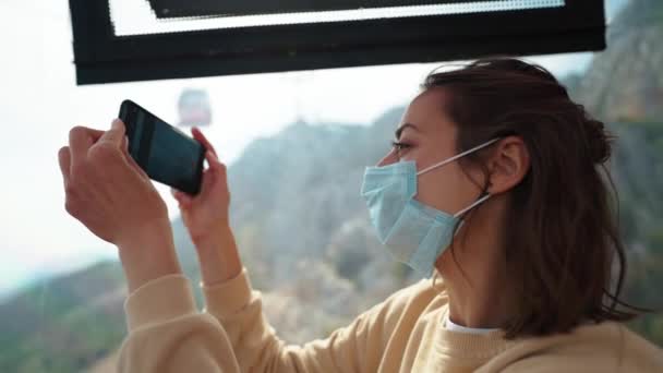 Young Woman Tourist Face Mask Sitting Cable Car While Moving — Stock Video
