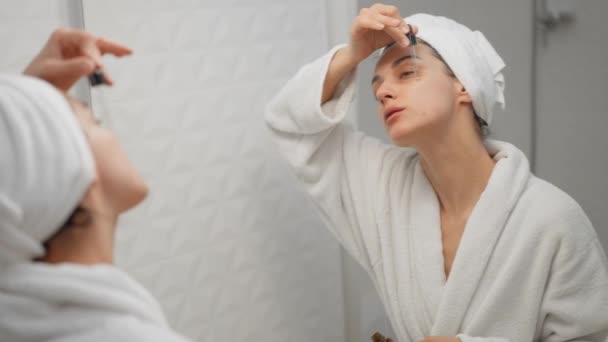 Stunning Woman Bathrobe Applying Serum Her Face Part Her Daily — Stock Video