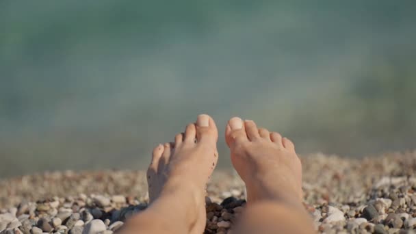 Closeup Female Bare Feet Legs Sea Background Woman Lying Pebble — Stock Video