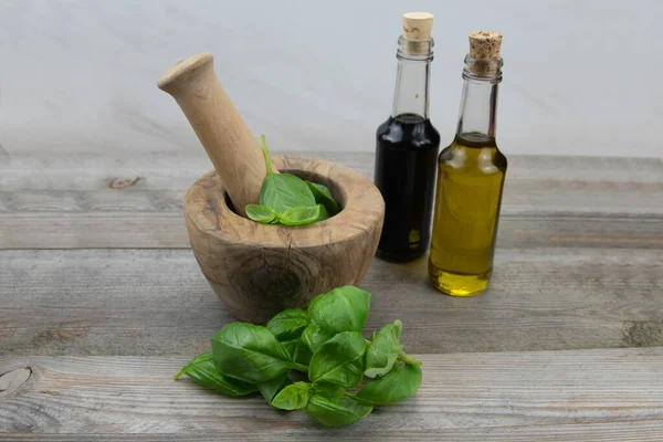 Wooden Mortar Pestle Basil Leaves Olive Oil Balsamic Vinegar Rustic — Stock Photo, Image