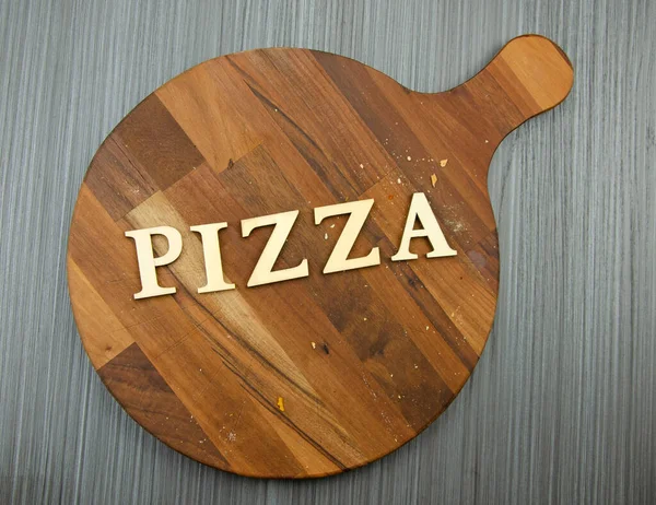 Dark Wood Pizza Board Crumbs Table Cloth Word Pizza Spelled — Stock Photo, Image