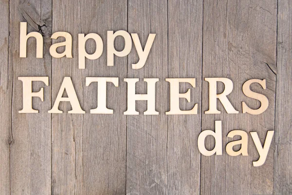 stock image Happy father's day letters on weathered timber. 