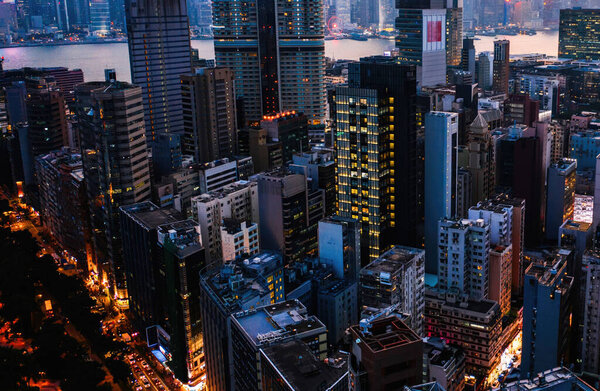 Aerial scenery panoramic view of Hong Kong modern skyscrapers district. Urban drone view with corporate business and financial enterprise buildings. Metropolitan city infrastructure in twilight time
