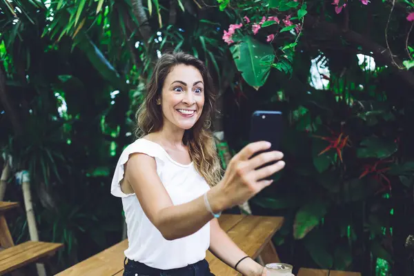 Beautiful Curly Female White Top Taking Selfie Smartphone Opening Eyes — Stock Photo, Image