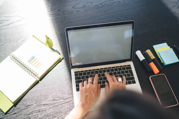 Crop Unrecognizable Person Typing Laptop While Sitting Table Notebook Smartphone Stock Photo
