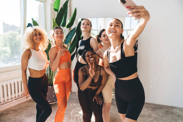 Group Cheerful Diverse Women Activewear Posing Mobile Phone Camera While Stock Picture
