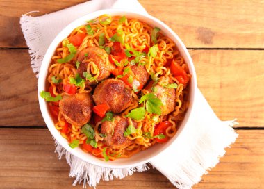 Meatballs with pepper and noodles in a bowl
