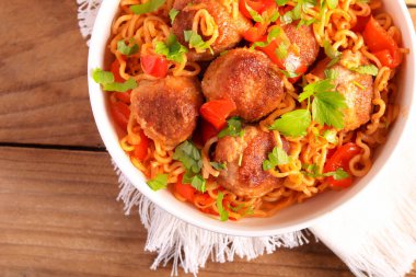 Meatballs with pepper and noodles in a bowl