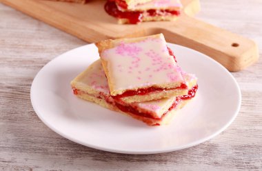Glazed raspberry pastry slices with sprinkles