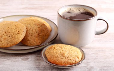 Nut and coconut homemade cookies with cup of coffee